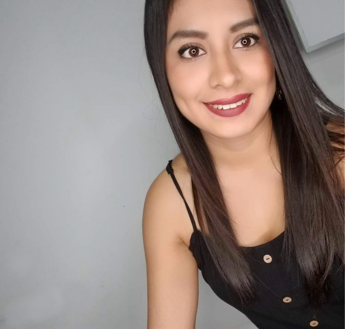 A smiling woman in a relaxed portrait