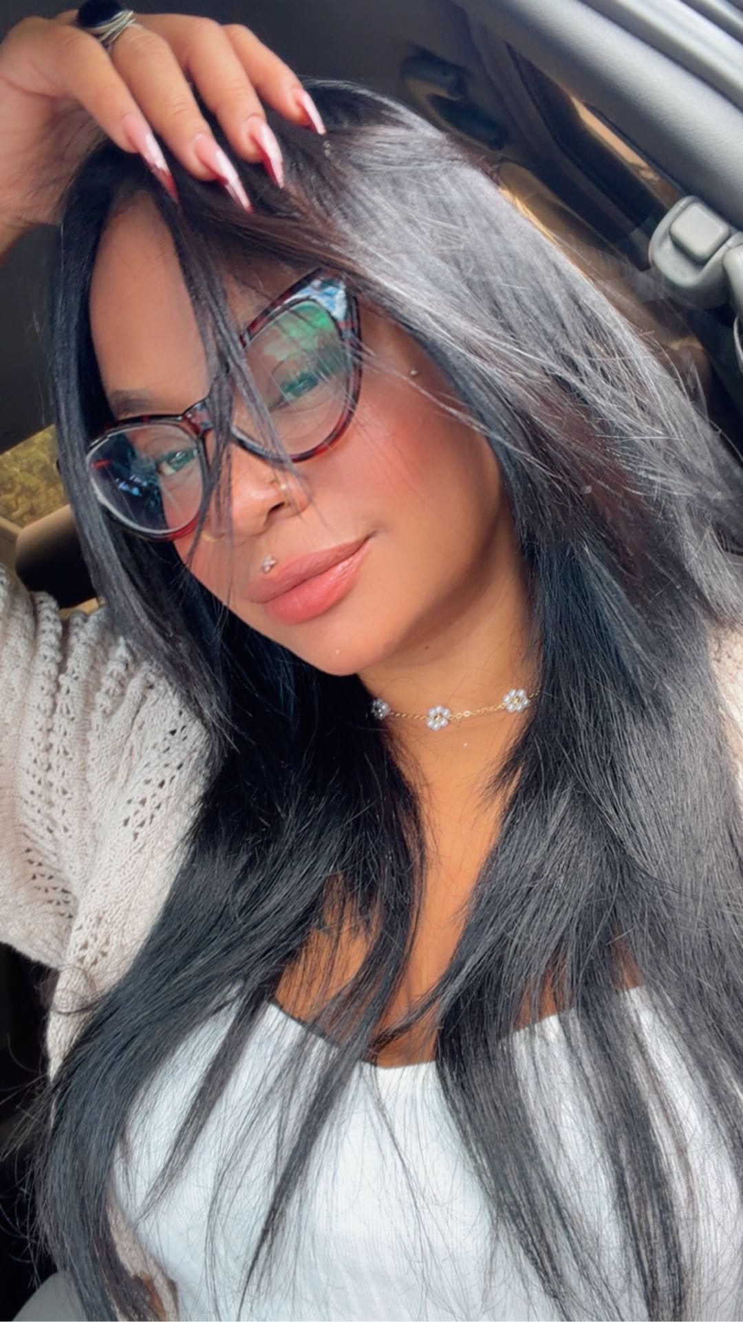 A relaxed portrait wearing glasses